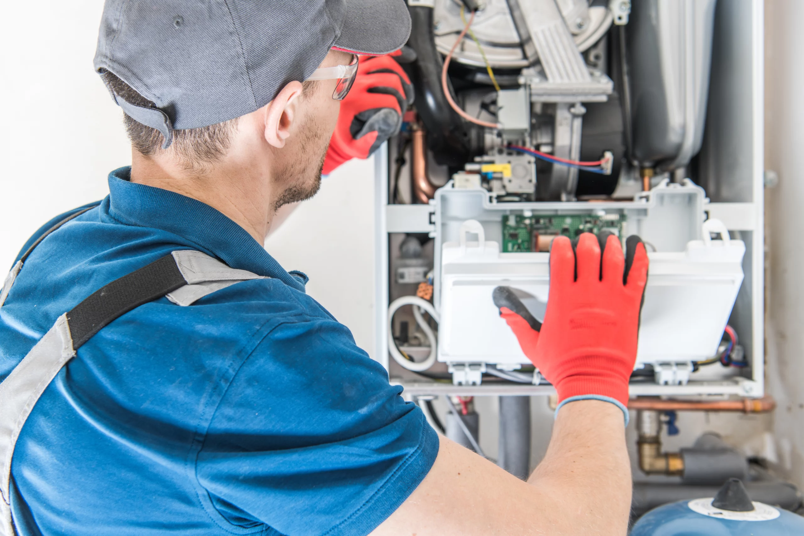 Man Performing Gas Furnace Repair